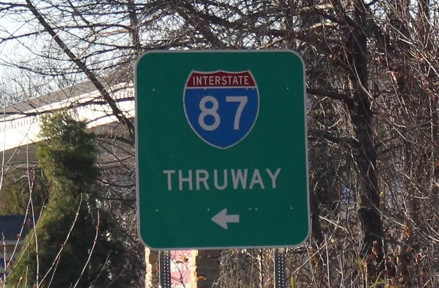 A New York State Thruway/I-87 road sign.